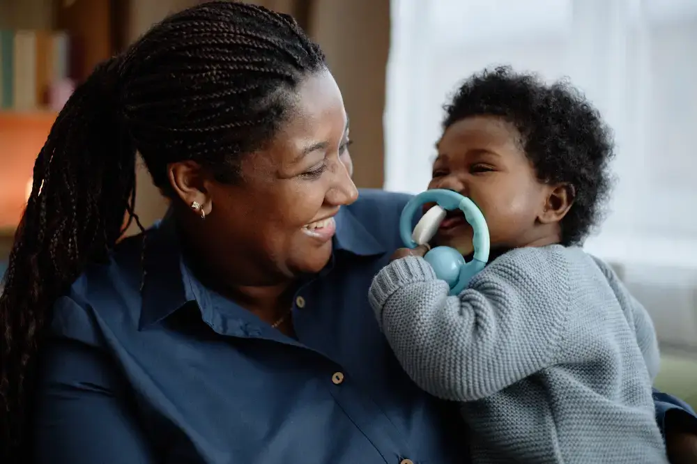 black woman holding a baby