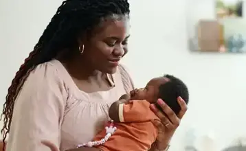 Woman holding a baby girl