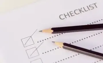 Checklist form with paper and pencil